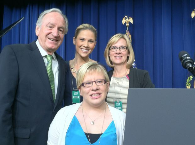Em-at-White-House-for-WIOA-signing Photograph of Em, Ashlea, and Tami Lantz posing with former US Senator Tom Harkin